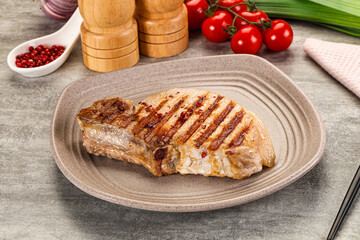 Grilled pork loin steak with bone