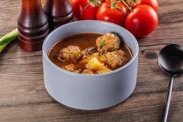 Tomato Soup with meatballs and vegetables