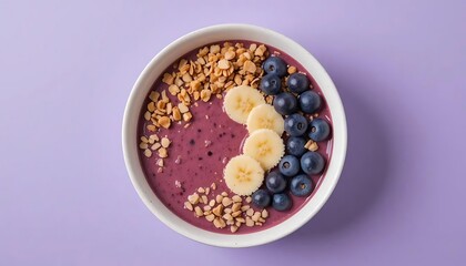 Delicious smoothie bowl with blueberries bananas and granola for healthy breakfast or snack idea concept