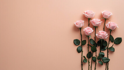 Flat lay of pink roses stems on pastel peach for minimalist floral designs. Perfect for romantic wallpapers, feminine branding, and serene art prints.