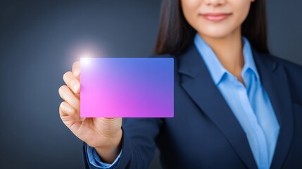 Professional woman displaying a vibrant blank card for branding or networking.