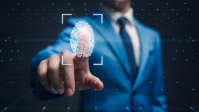 A businessman uses biometric fingerprint scanning technology for secure access authorization modern digital security authentication system. - Powered by Adobe