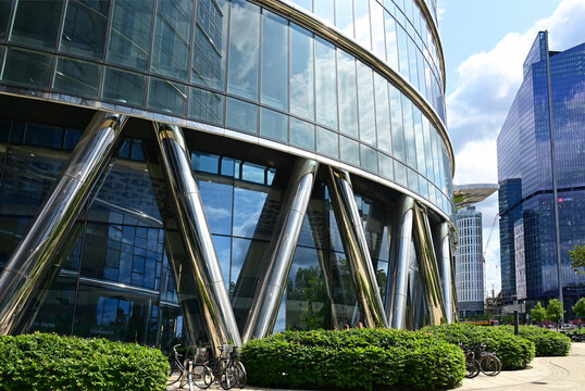 Warsaw, Wola, Poland, Europe - 06.2025 : Plac Europejski, view for Rondo Daszyńskiego, Warsaw Spire with characteristic diagonal supports, The Hub with Skyliner at right, all buildings by Ghelamco