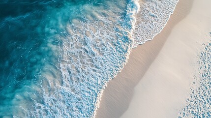 Soft waves forming patterns on white beach sand .