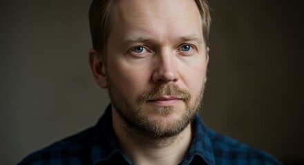 Obraz premium Portrait of a Man with Blue Eyes