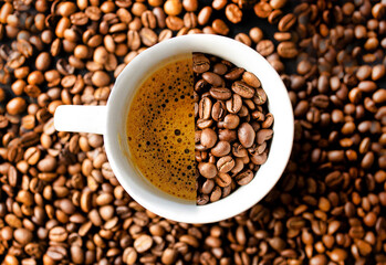 A white cup rests on a bed of coffee beans, evoking the rich aroma and allure of fresh coffee....