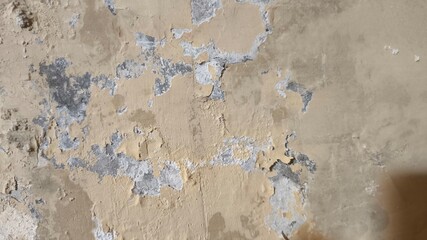 Horizontal cracked painted wall surface with aged texture, weathered old layers of peeling color...