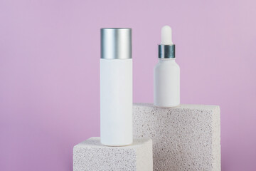Plastic white tube for cream or lotion. Skin care or sunscreen cosmetic with stylish props on...