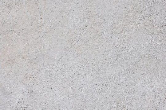 Neutral whitewash texture outdoor wall under daylight