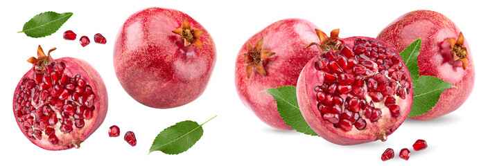 piece of pomegranate with seeds and green leaves isolated on a white background. clipping path