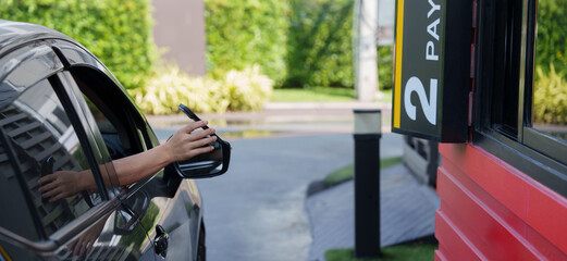 Scan and pay for food, pick up food from a drive-thru counter and take it to eat at home and at...