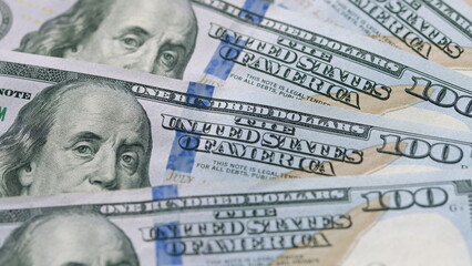 A CloseUp Image of U.S. One Hundred Dollar Bills and Their Significance in Finance and Commerce