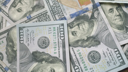A detailed closeup view of American Dollars in multiple denominations is presented here