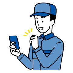 スマートフォンの画面を見てガッツポーズで喜ぶつなぎ作業服の男性