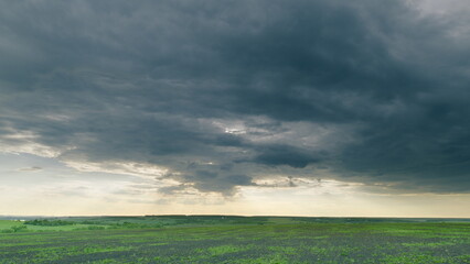 A Dramatic Sky Over a Lush Green Field is Beautifully Captured in a Scenic Landscape Time lapse.