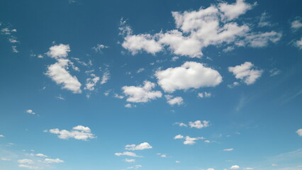 A Clear Blue Sky filled with Fluffy White Clouds, perfect for enjoying a serene day outside