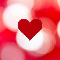 Red heart shape on red and white bokeh background