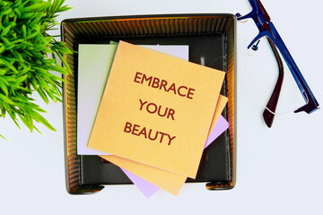 The conceptual phrase EMBRACE YOUR BEAUTY. The concept of beauty and health