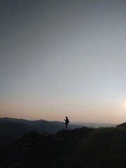 silhouette of a man in the mountains at dawn, freedom, mountains in Siberia