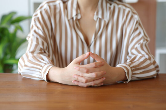 Woman hands waiting and listening in a house