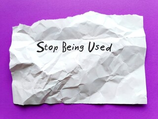 Torn crumple paper on purple background with text written Stop Being Used - Self reminder to avoid...