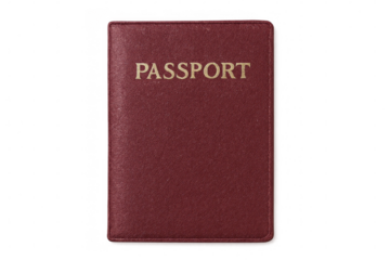 Golden-inscribed red passport lying flat, symbolizing global mobility and personal identification process