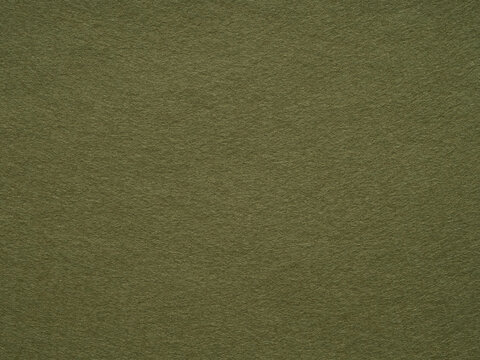 Uniform olive green felt texture offers a canvas of natural elegance and minimalist design