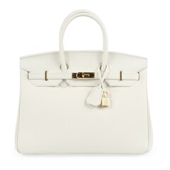 White leather handbag in Birkin style with gold hardware isolated on a white background