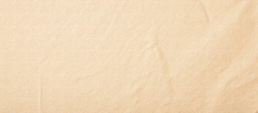 Beige craft paper texture with wrinkles and fine grain. Natural recycled paper background for design, art, and eco concepts