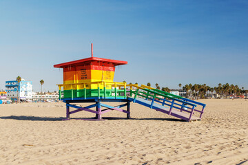 Vibrant lifeguard tower painted in LGBTQ rainbow colors