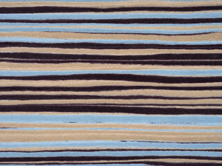 Swirls of midnight black, sandy beige, and oceanic blue dance across this zebrawood veneer, a natural opus of earthy rhythms