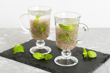 Healthy breakfast or morning with chia seeds and mint on table background, vegetarian food, diet...