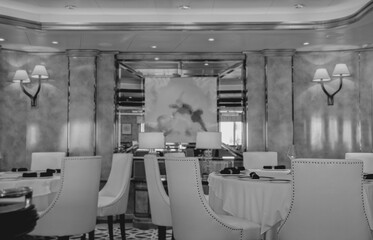 Formal and elegant ocean view dining room restaurant onboard luxury cruiseship or cruise ship liner...