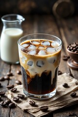 Iced Coffee with Cream and Ice Cubes on Rustic Wooden Table