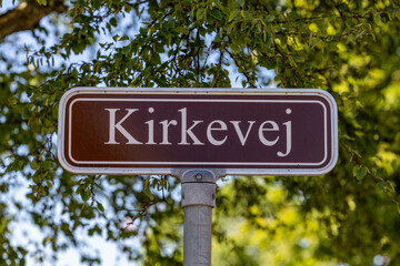 Fototapeta premium Skagen, Denmark A street sign in Danish says Kirkevej, or Church Street.