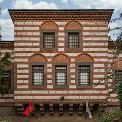 Kizlaragasi Hani Bazaar, in Izmir, Turkey showcases stunning Ottoman architecture with its distinctive striped facade and arched windows