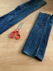 Tracing a sewing pattern and cutting pieces - preparations for upcycling an old blue jeans