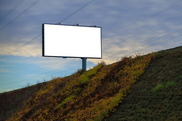 White billboard along the highway. Background for design and advertising.
