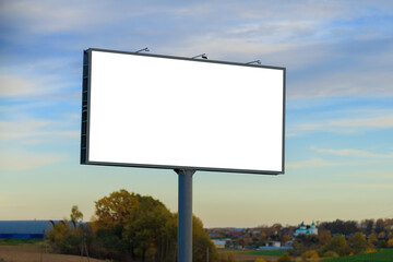 White billboard along the highway. Background for design and advertising.