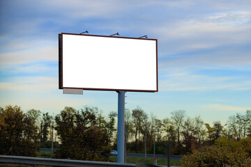 White billboard along the highway. Background for design and advertising.