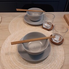 Minimalist table setting with bowls and chopsticks