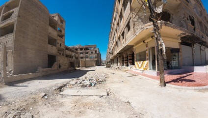 Deserted Street with Damaged Buildings In Damascus Jobar district, Syria