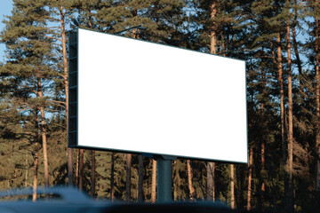 White billboard along the highway. Background for design and advertising.