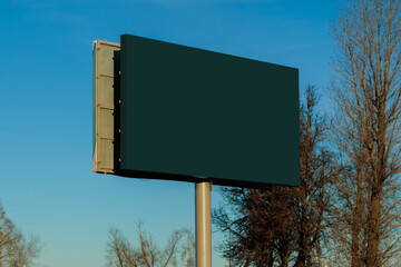 Background for design. Advertising billboard along the road in the city on a sunny day