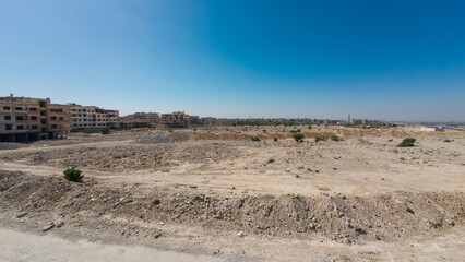 Barren Urban Landscape with Distant Buildings In Damascus Jobar district, Syria
