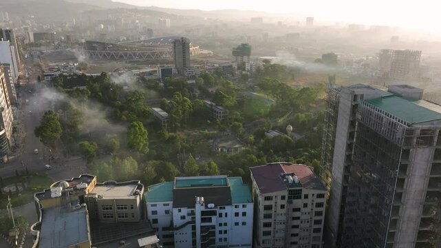 Misty Landscape Around Addis Ababa Stadium Under Construction At Sunrise In Ethiopia. - aerial shot