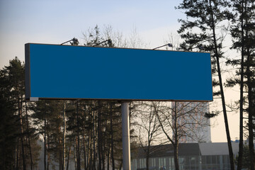 Background for design. Advertising billboard along the road in the city on a autumn sunny day