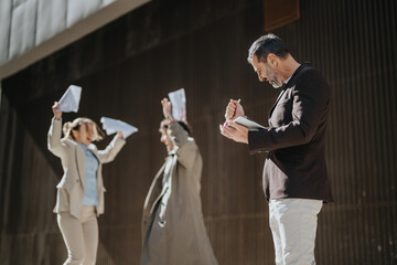 Business colleagues collaborate in an outdoor setting. The joyful expressions and professional...