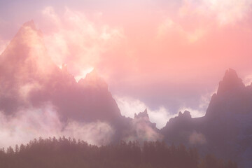 Naklejka premium Colorful evening mountains landscape with clouds