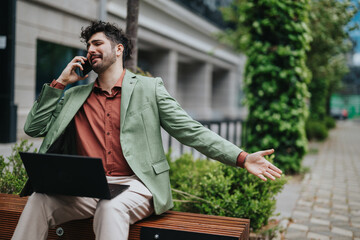 Person using a smart phone outdoors in a business setting. The individual is sitting on a bench,...